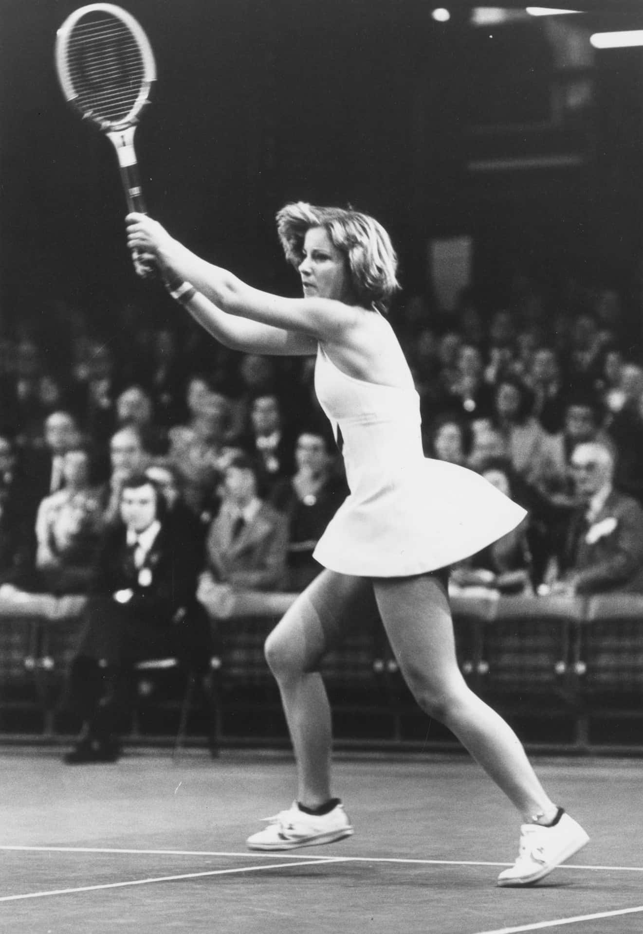 Chris Evert in Action - Powerful Court Chase Wallpaper