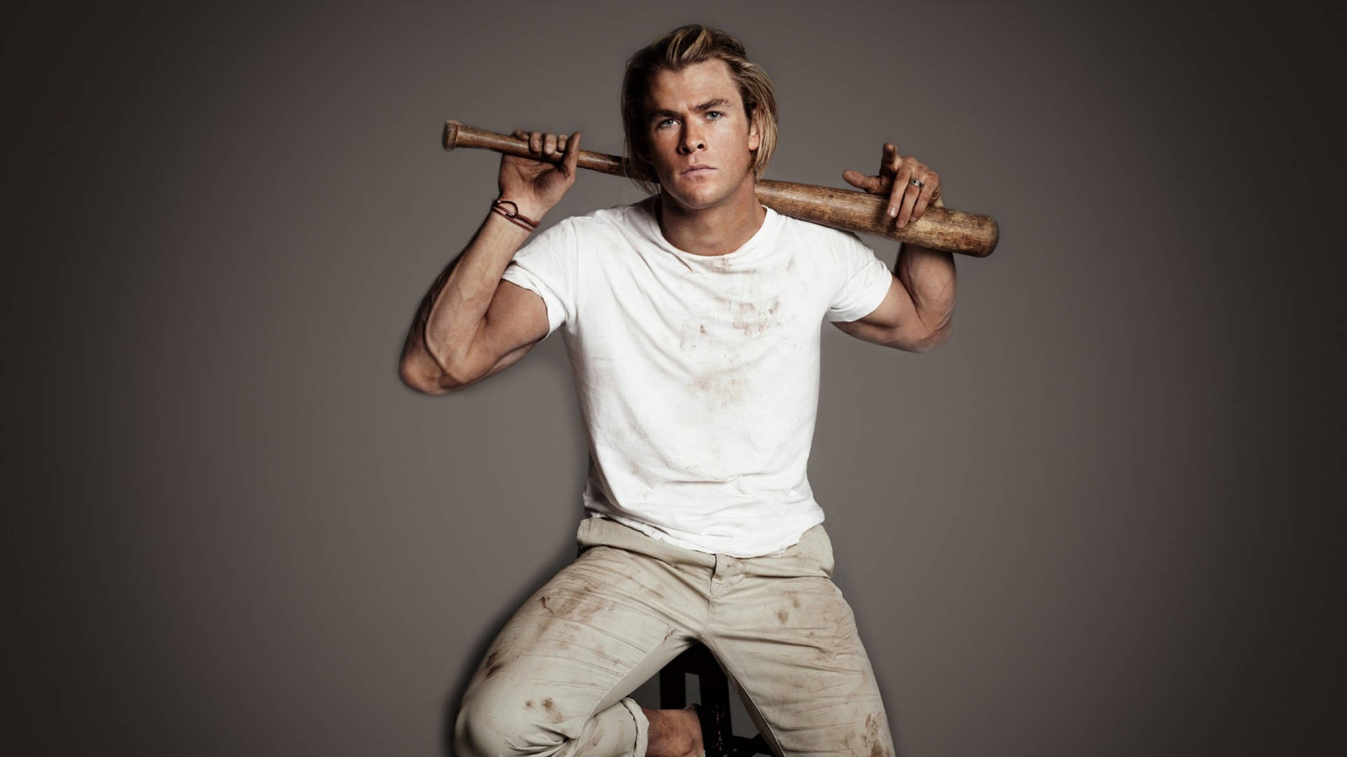 Chris Hemsworth, star of Thor and the Avengers series, holds a bat. Wallpaper