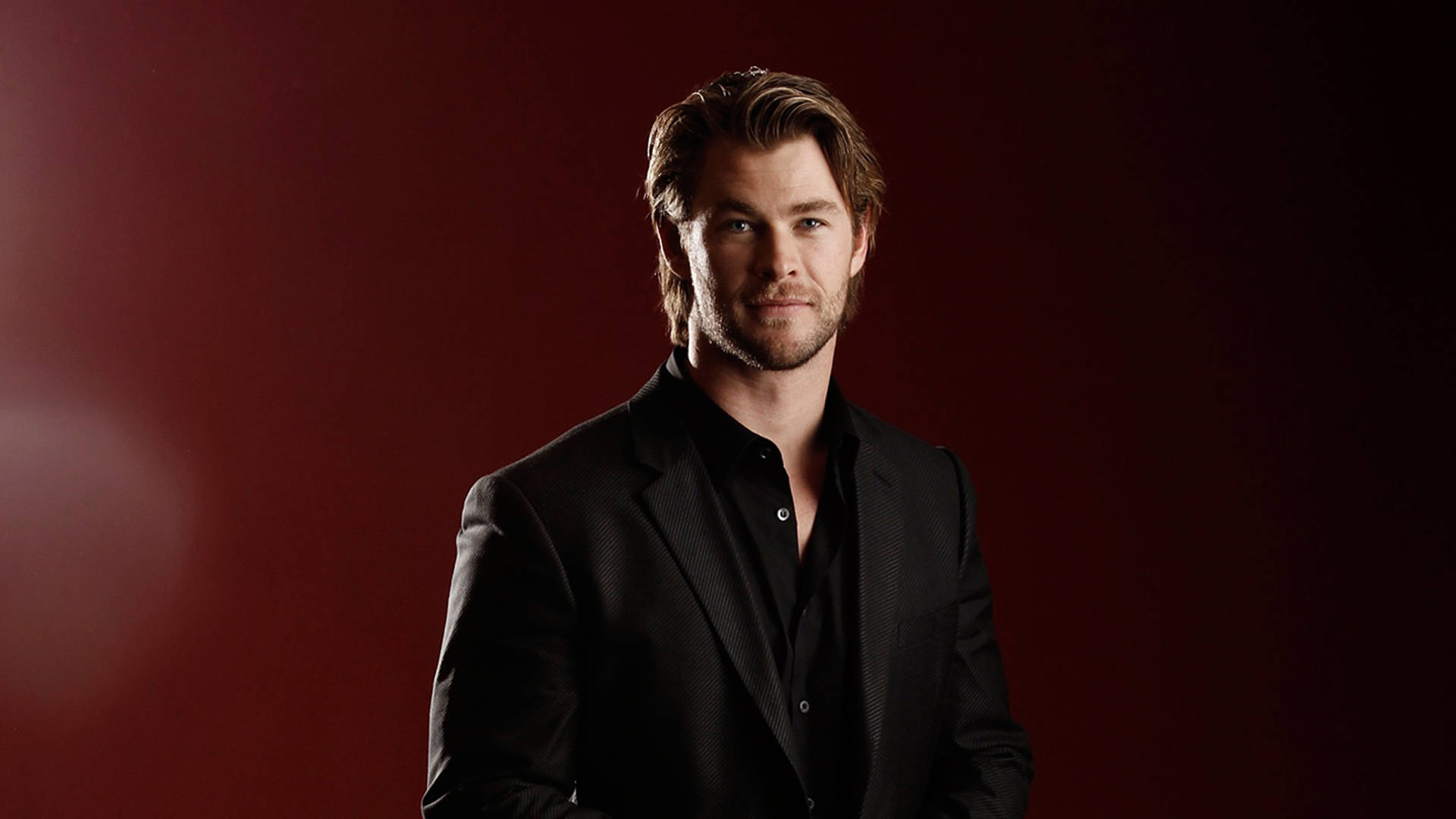 Chris Hemsworth In Black Formal Outfit Background