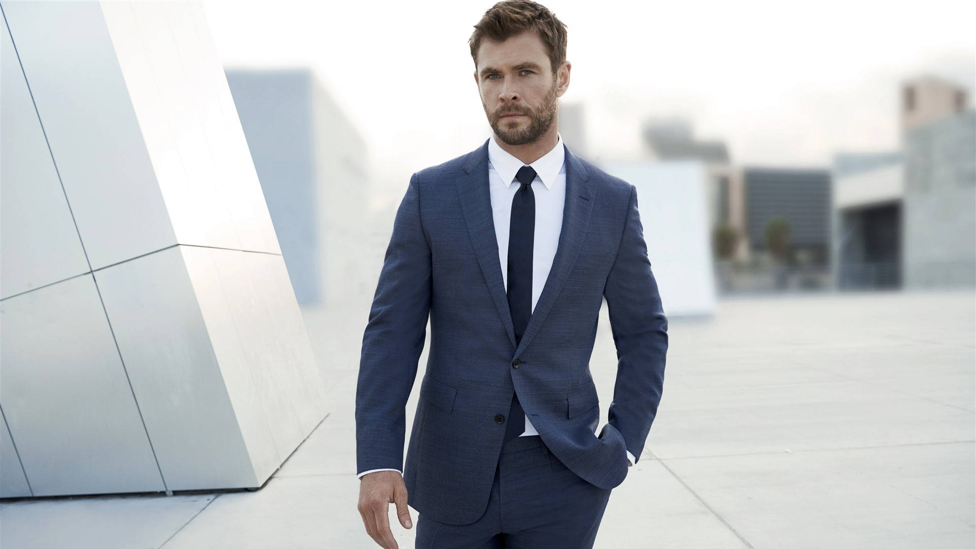 Chris Hemsworth looks confident and powerful in a suit. Wallpaper