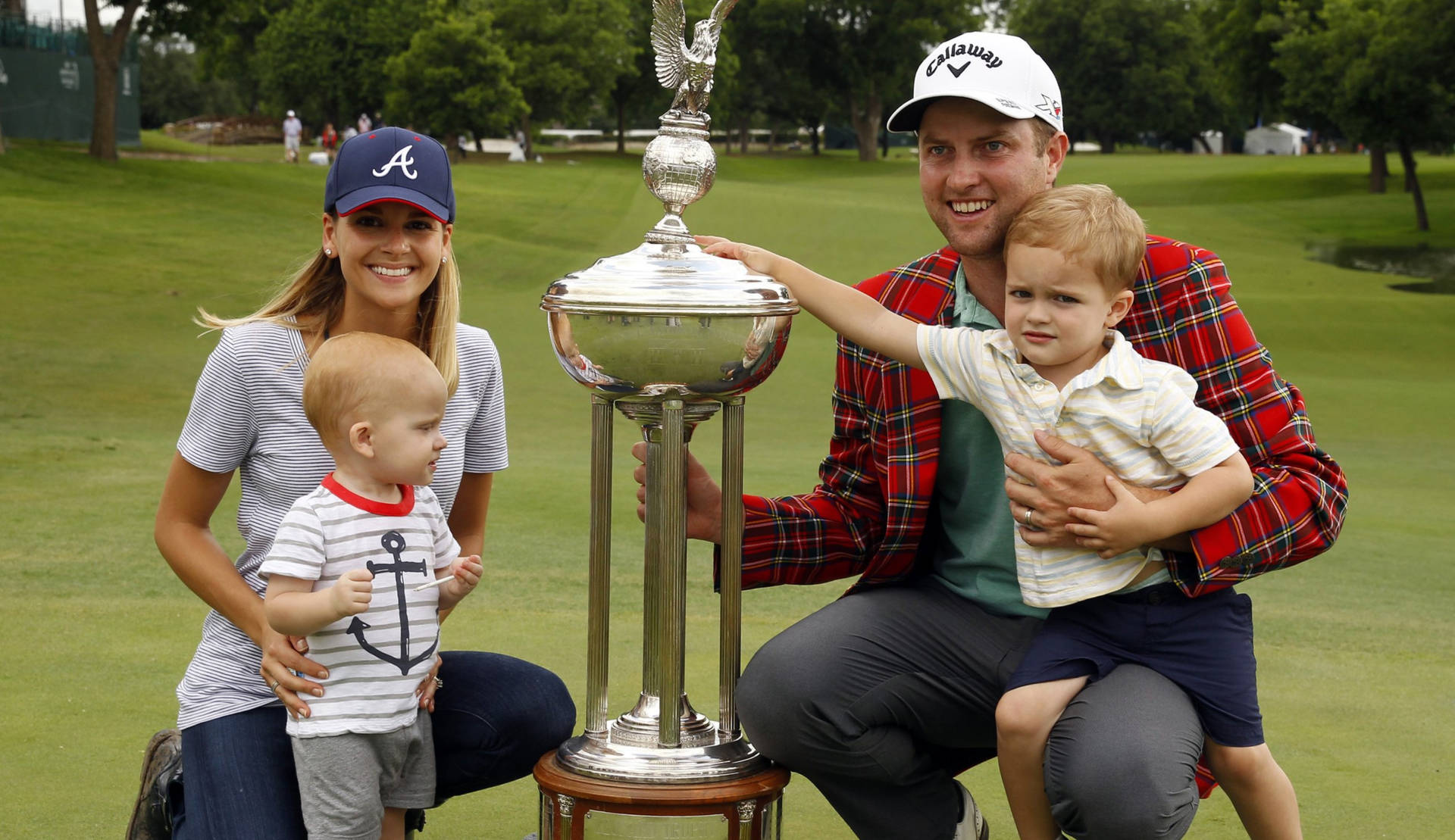 Chris Kirk With Family And Trophy Wallpaper