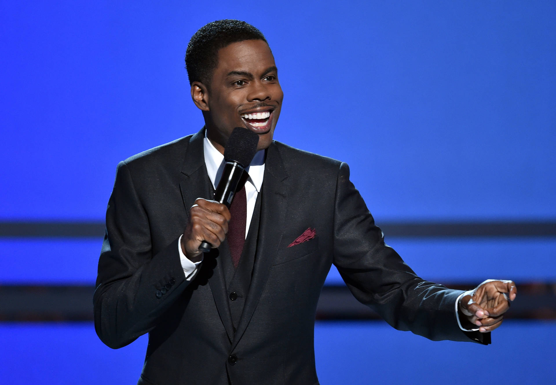 Chris Rock Delivering a Stand-Up Performance Wallpaper
