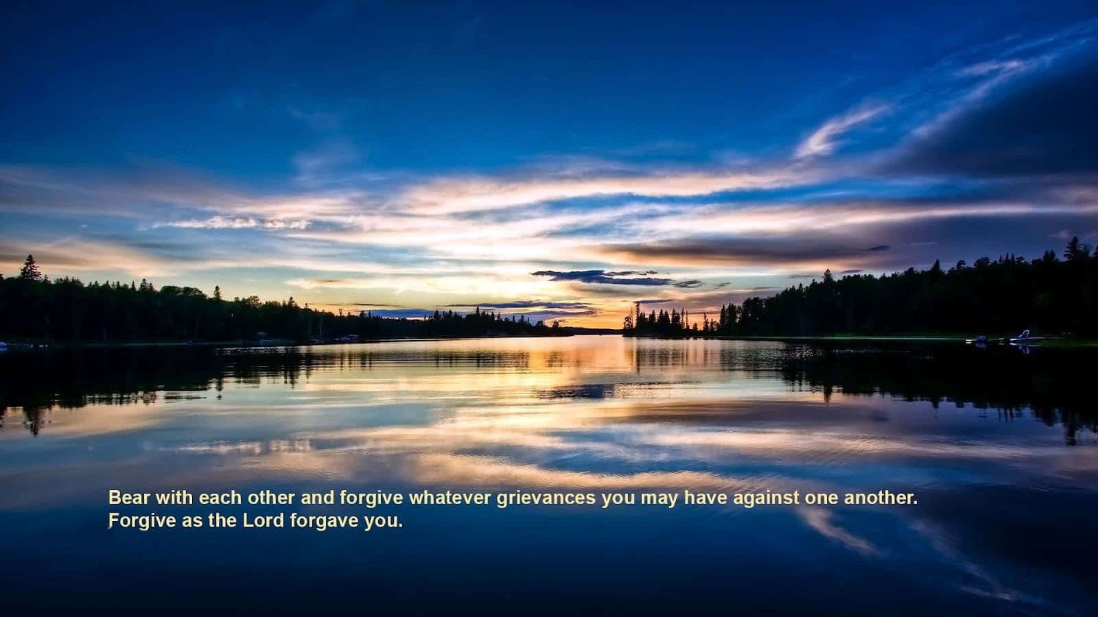 A Lake With A Sunset And A Quote Wallpaper