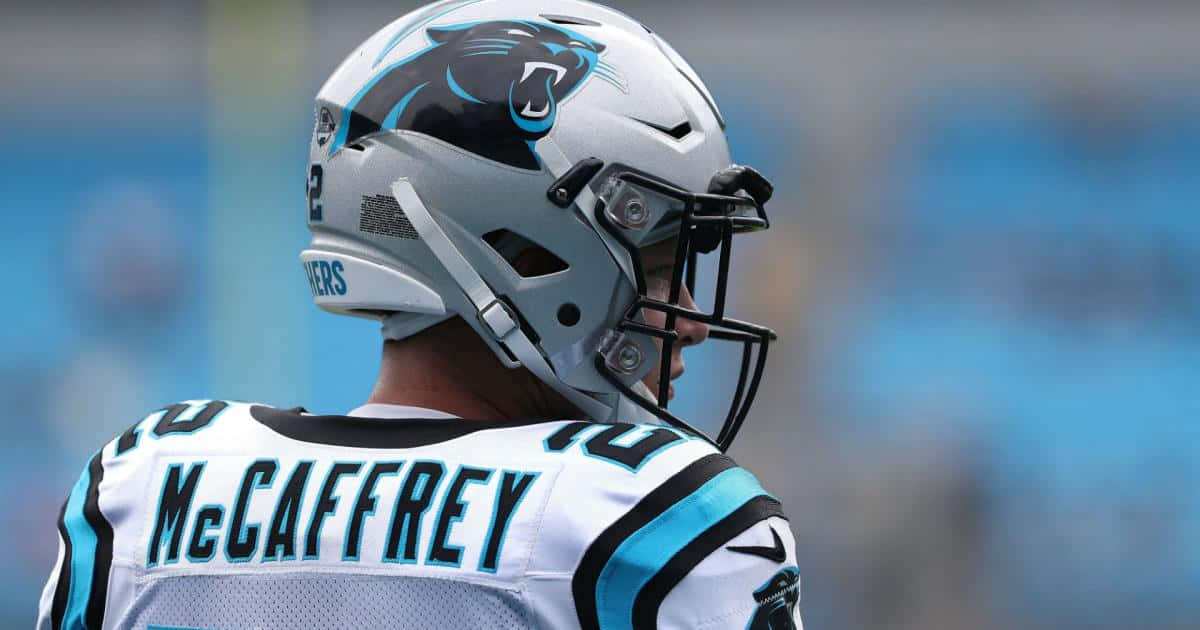 Christian Mccaffrey playing football as a Running back for the Carolina Panthers Wallpaper