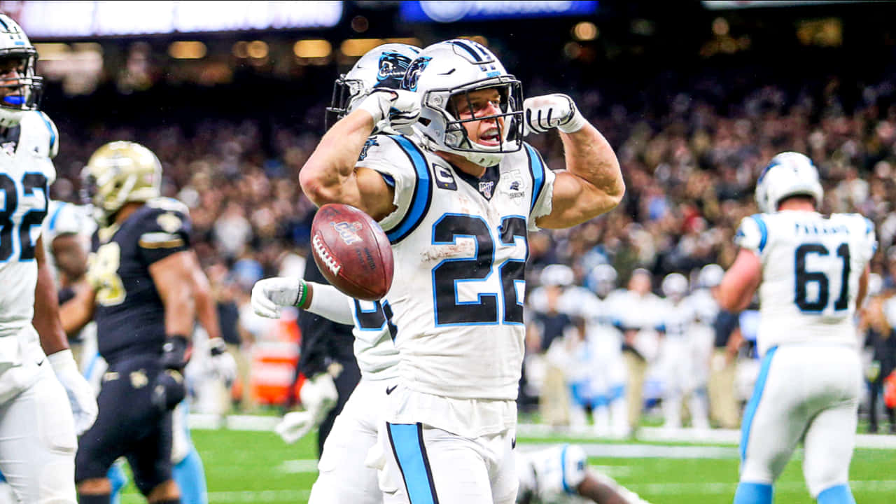 "Christian Mccaffrey on the Field in Action" Wallpaper