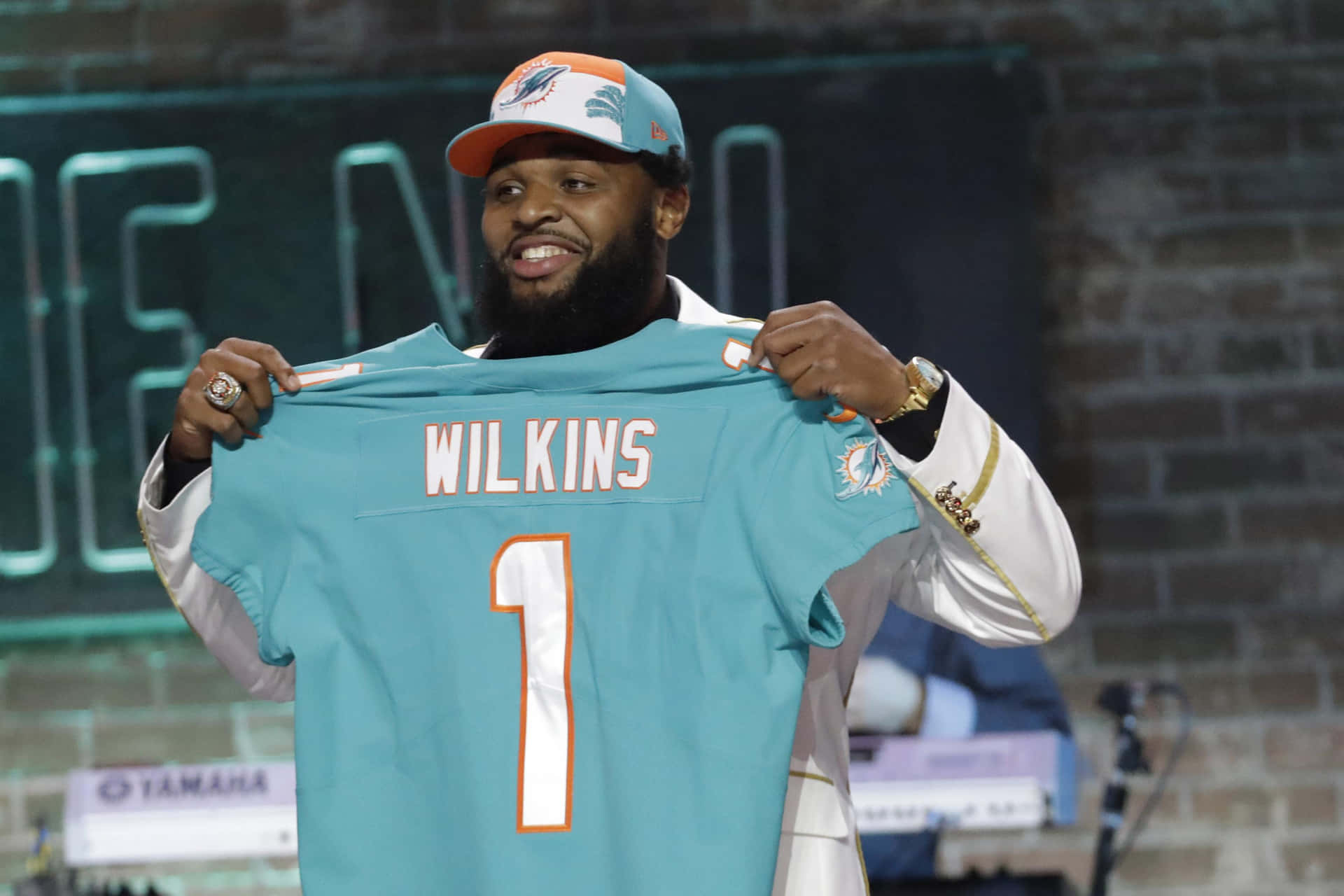 Christian Wilkins Holding Dolphins Jersey Wallpaper