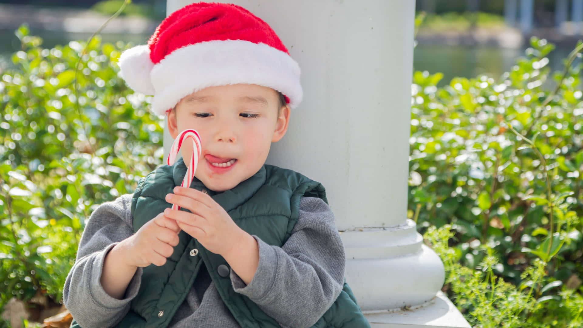 Christmas Boy With Candy Cane Wallpaper