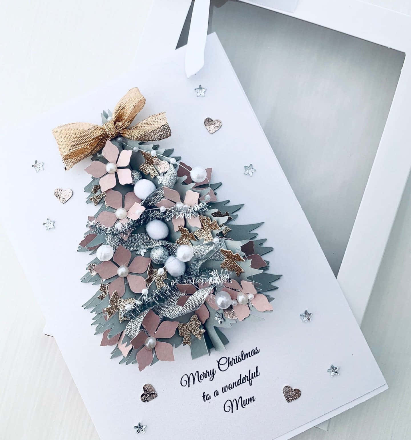 A Christmas Card With A Christmas Tree And Bow