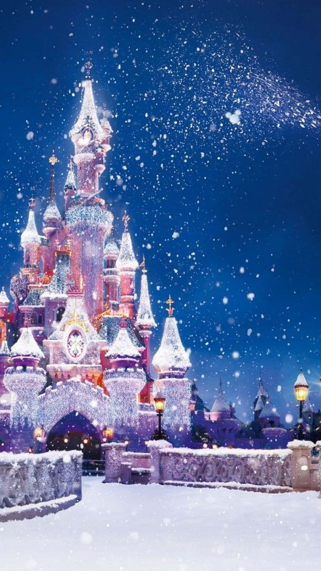 A Castle Is Covered In Snow And Snowflakes Wallpaper