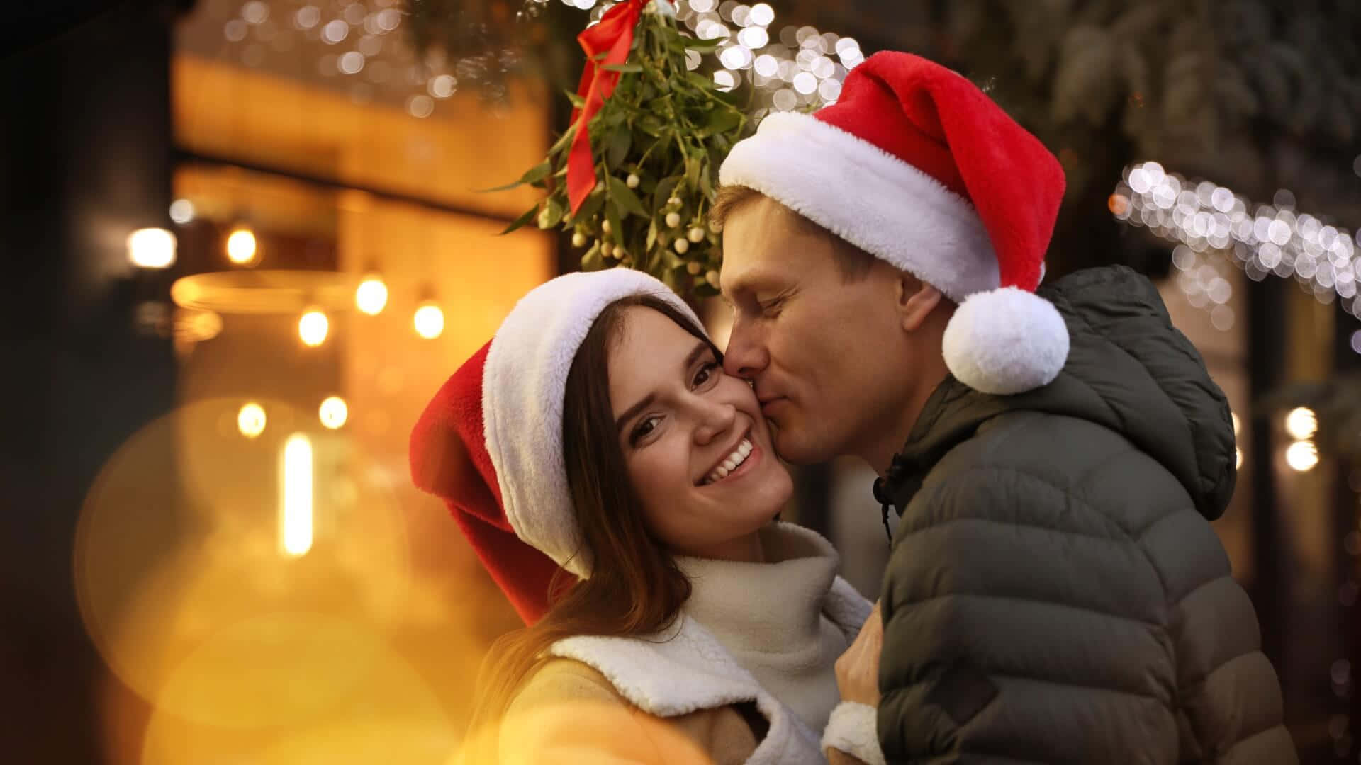 Christmas Couple Kissing Cheeks Picture