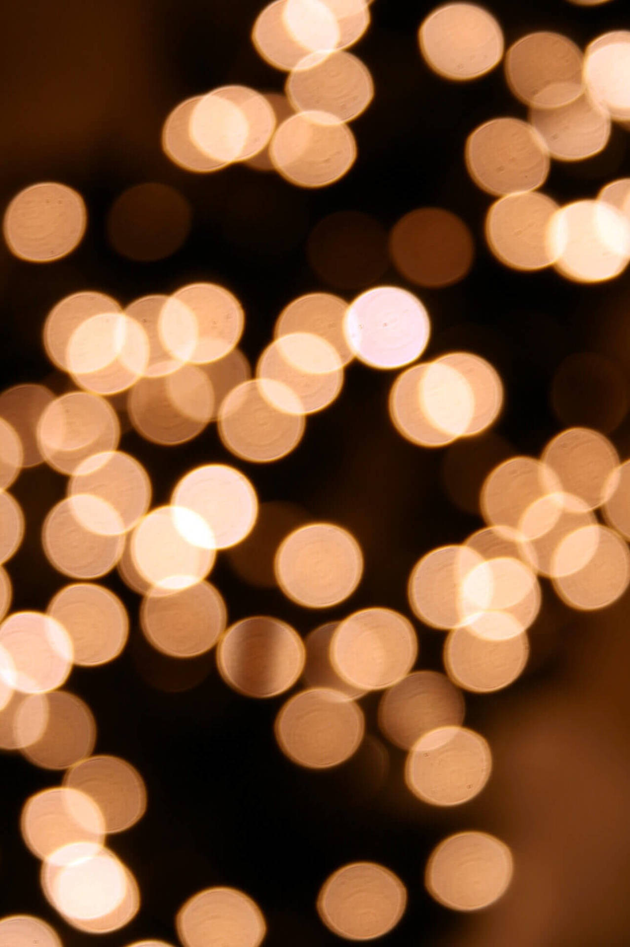 "Delicate Christmas lights in a warm, dreamy atmosphere". Wallpaper