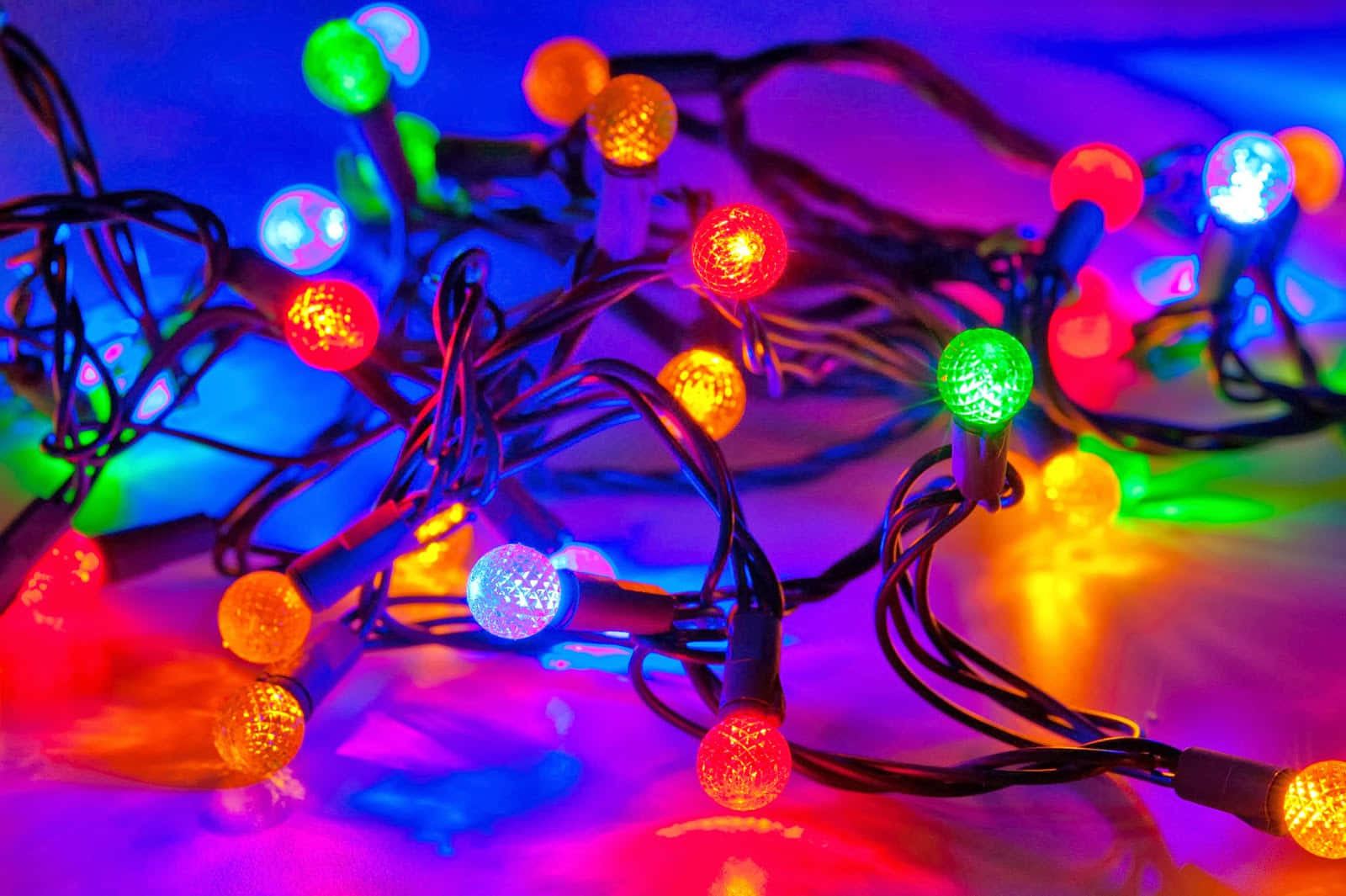 Enjoy The Sparkle Of Festive Christmas Lights Wallpaper