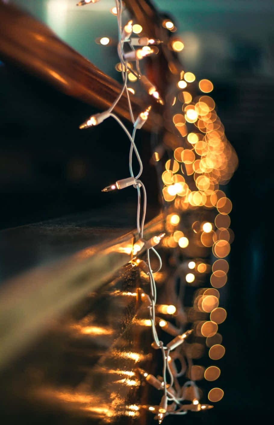 Spread the holiday cheer this season with twinkling Christmas lights! Wallpaper