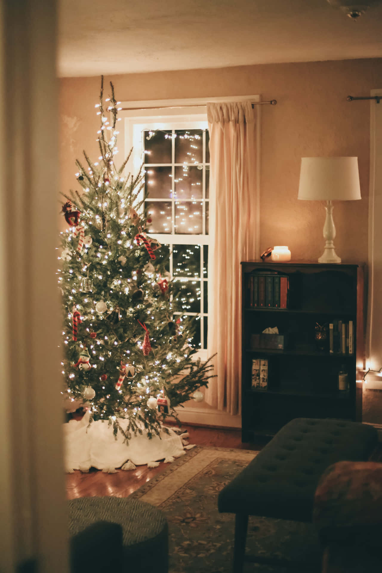 Enjoy festive decorations in this cozy Christmas Living Room