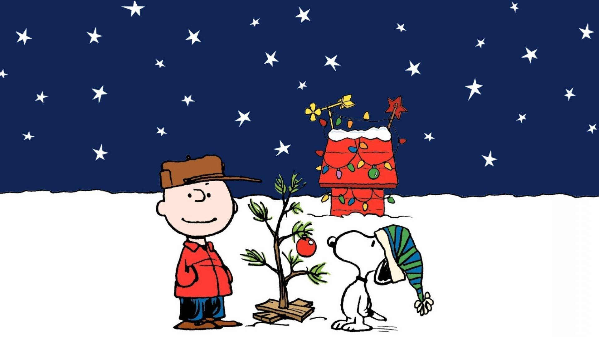 Charlie Brown og Snoopy med et juletræ Wallpaper