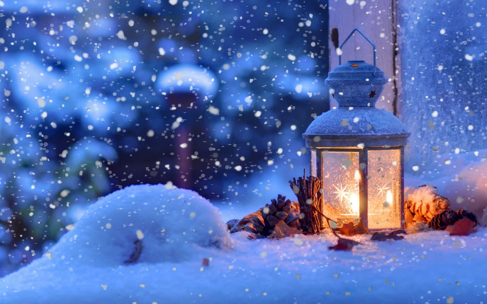 A Lantern Is Sitting On A Snow Covered Window Wallpaper