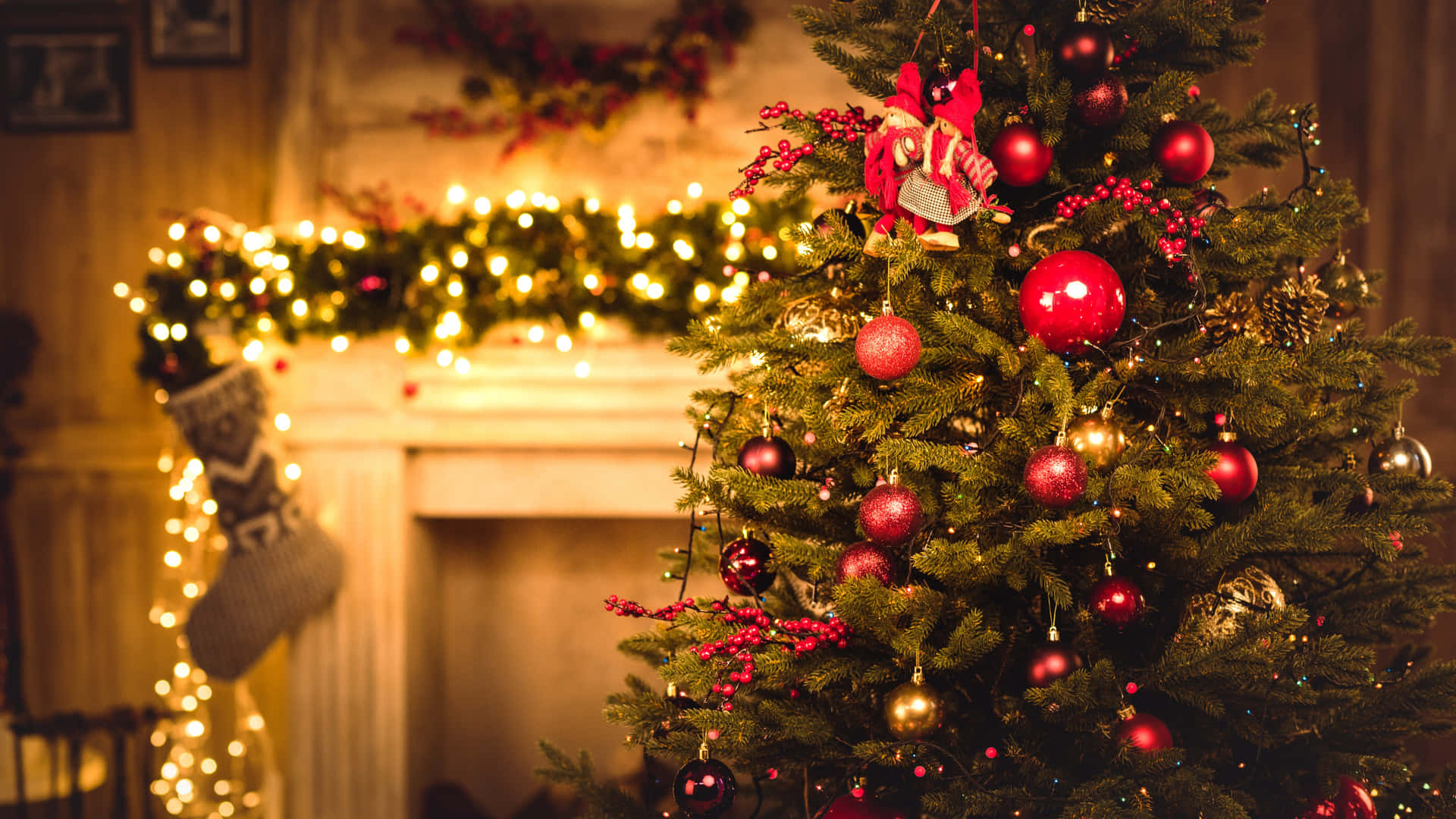 A Christmas Tree With Decorations In Front Of A Fireplace Wallpaper
