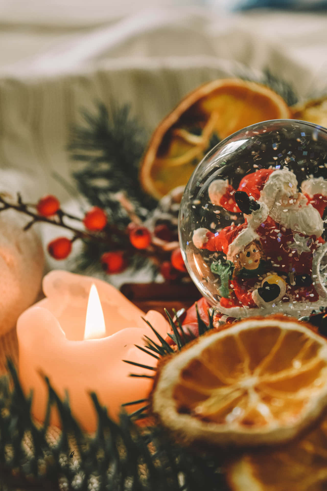 Snow Globe Beside Candle Christmas Photo Background