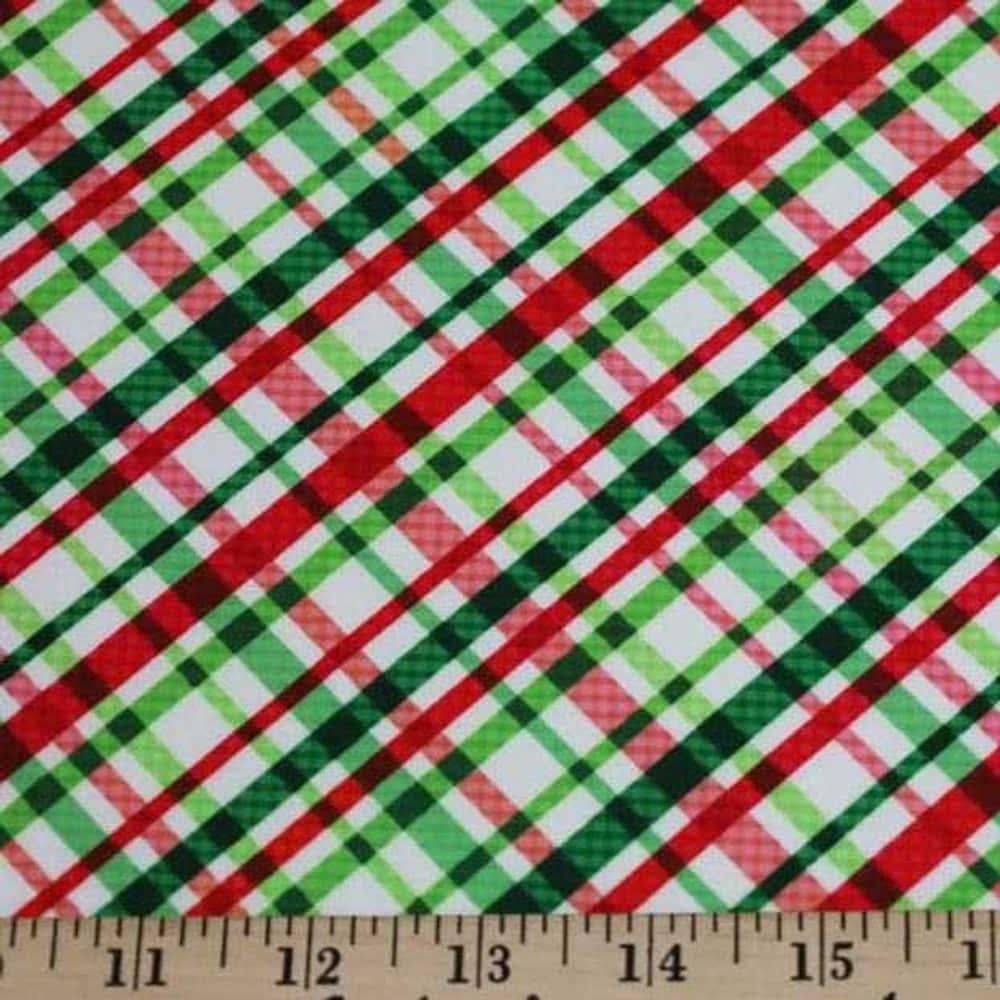 "Celebrate the holiday season with this cozy Christmas plaid background."