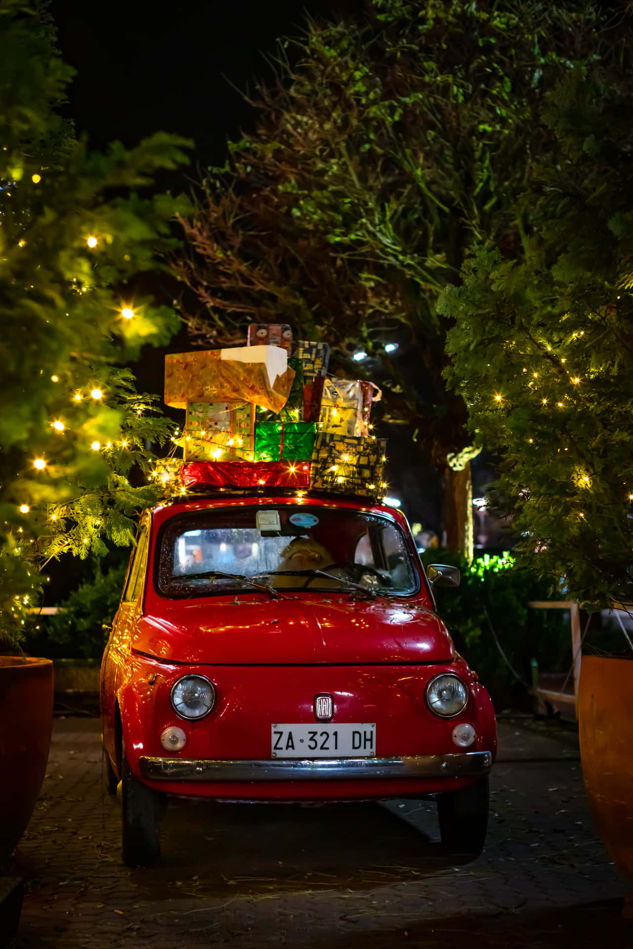 Red Classic Fiat Car With Gifts Christmas Scene Background