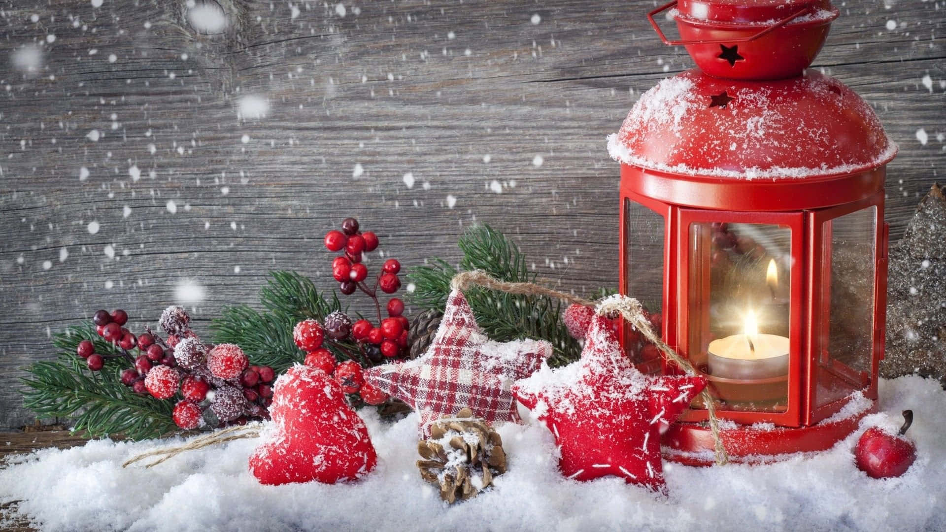 Red Lantern With Snow And Decorations On A Wooden Table Wallpaper