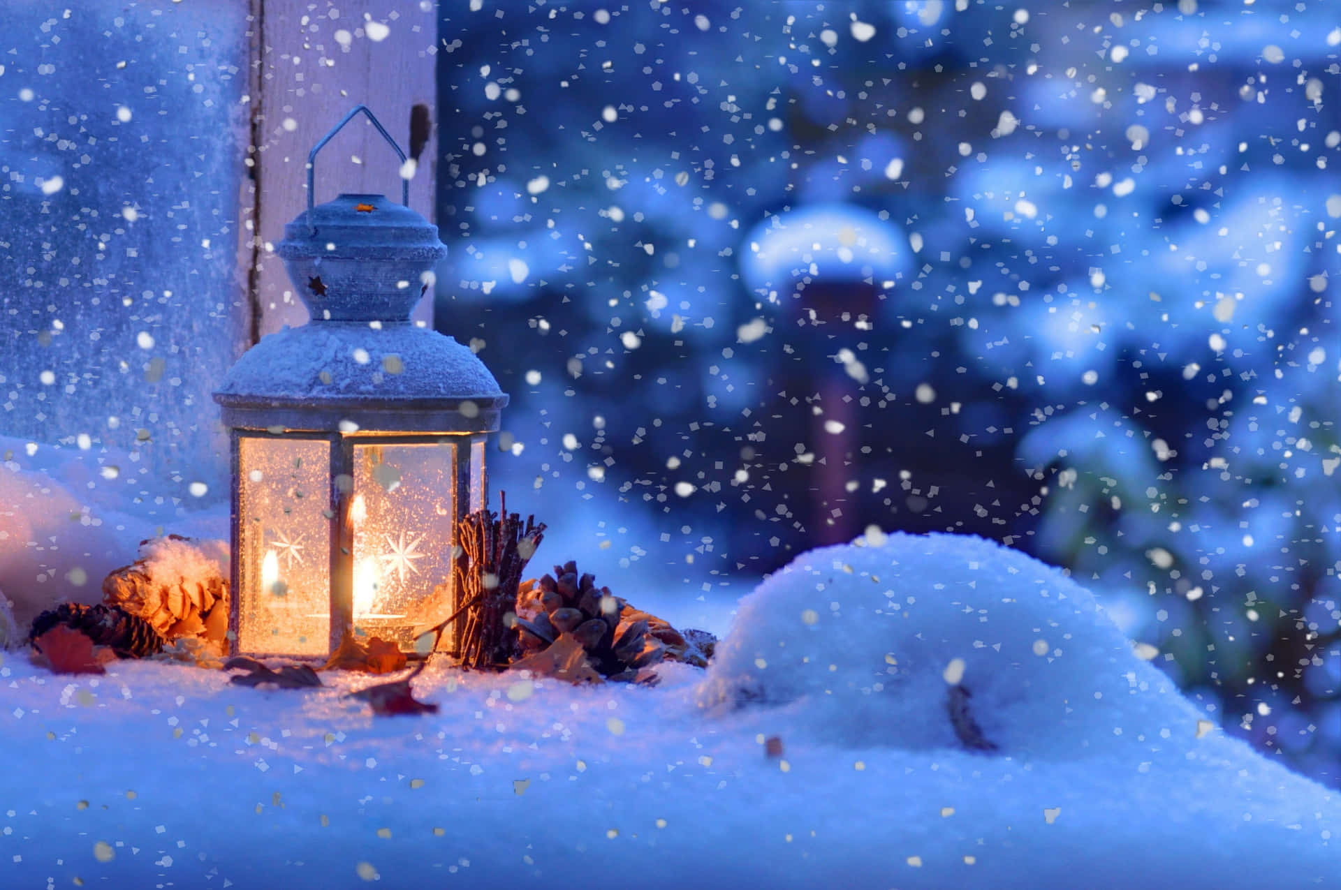 Christmas Snow scene lit up by warm street lights Wallpaper