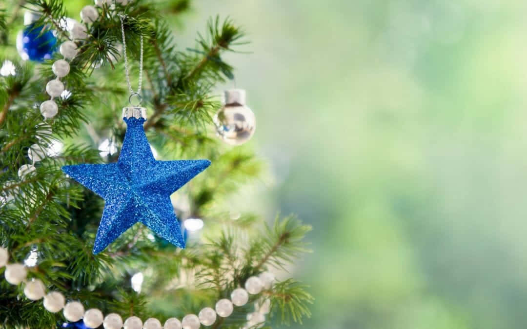 Christmas Tree With Blue Star Ornaments And Ornaments Wallpaper