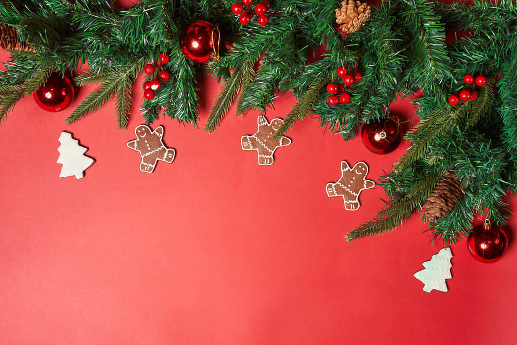 Red Christmas Theme Background With Gingerbread Man And Ornaments