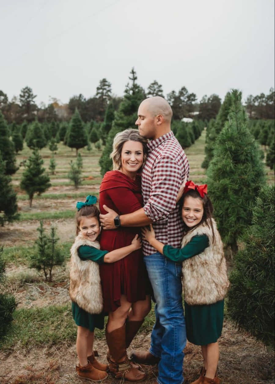 Glücklichefamilien-weihnachtsbaum-farm Bild