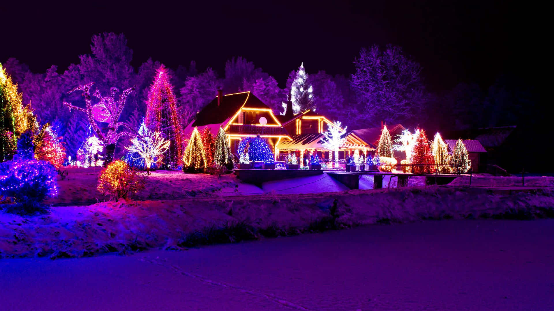 Enjoy the enchantment of a traditional Christmas Village Wallpaper