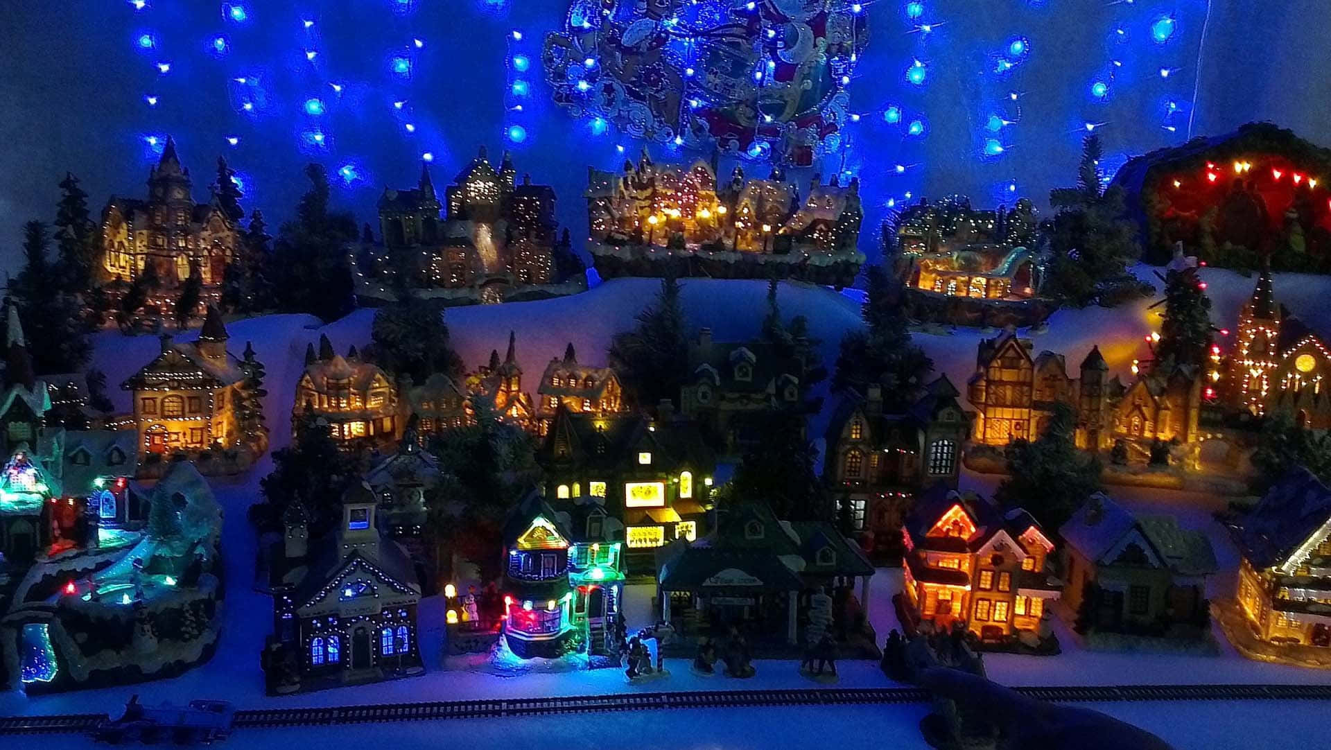 Spend your holidays in a magical Christmas Village Wallpaper