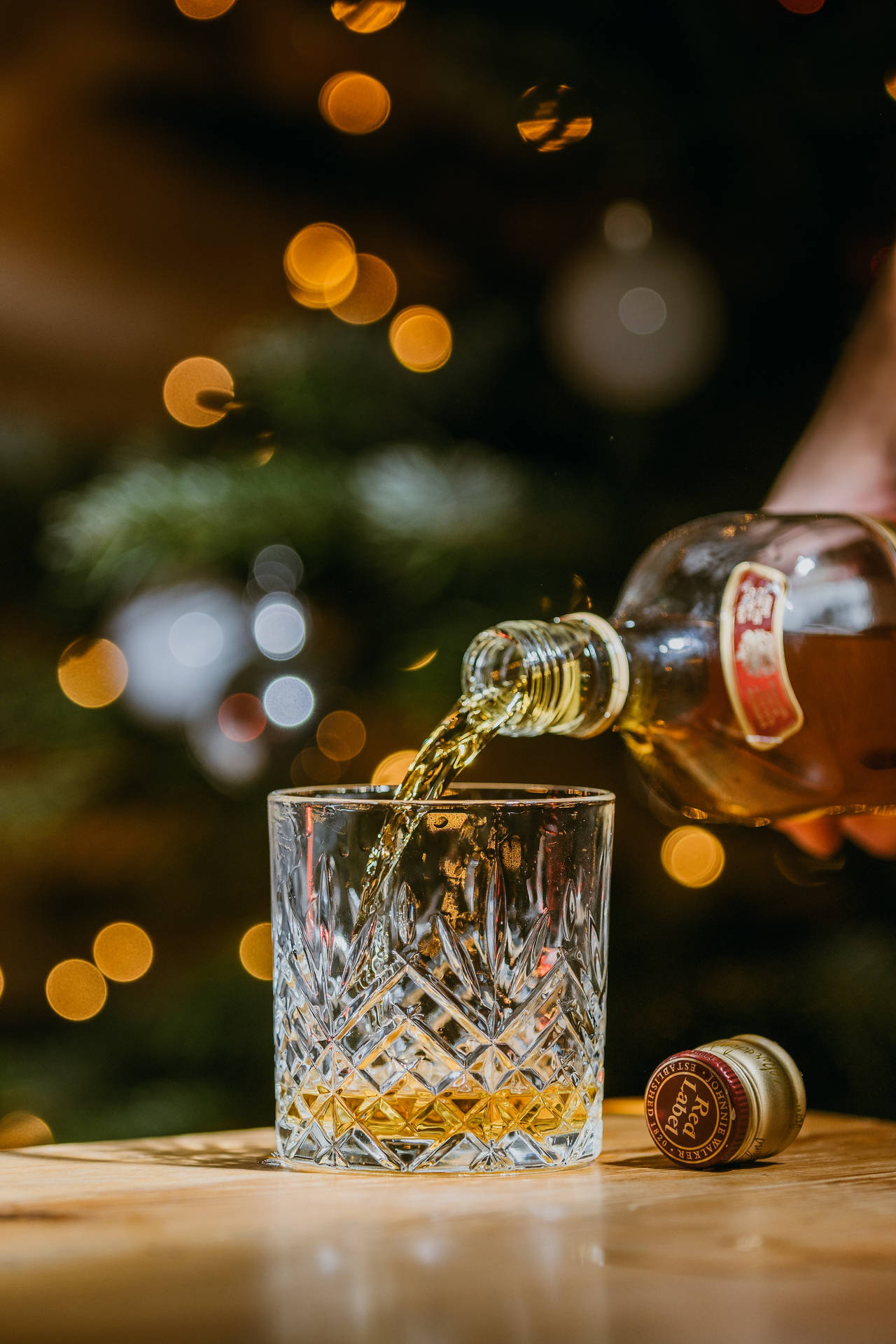 Christmas Whiskey Pouring On Glass Wallpaper