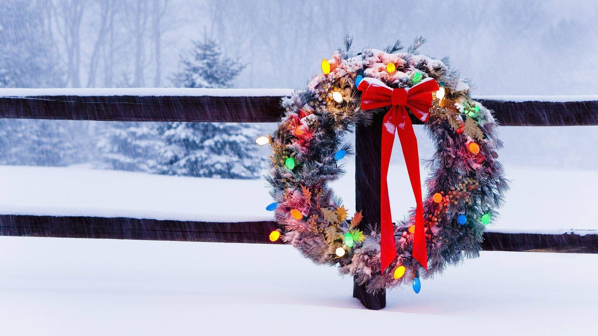 Christmas Wreath Covered In Snow Wallpaper