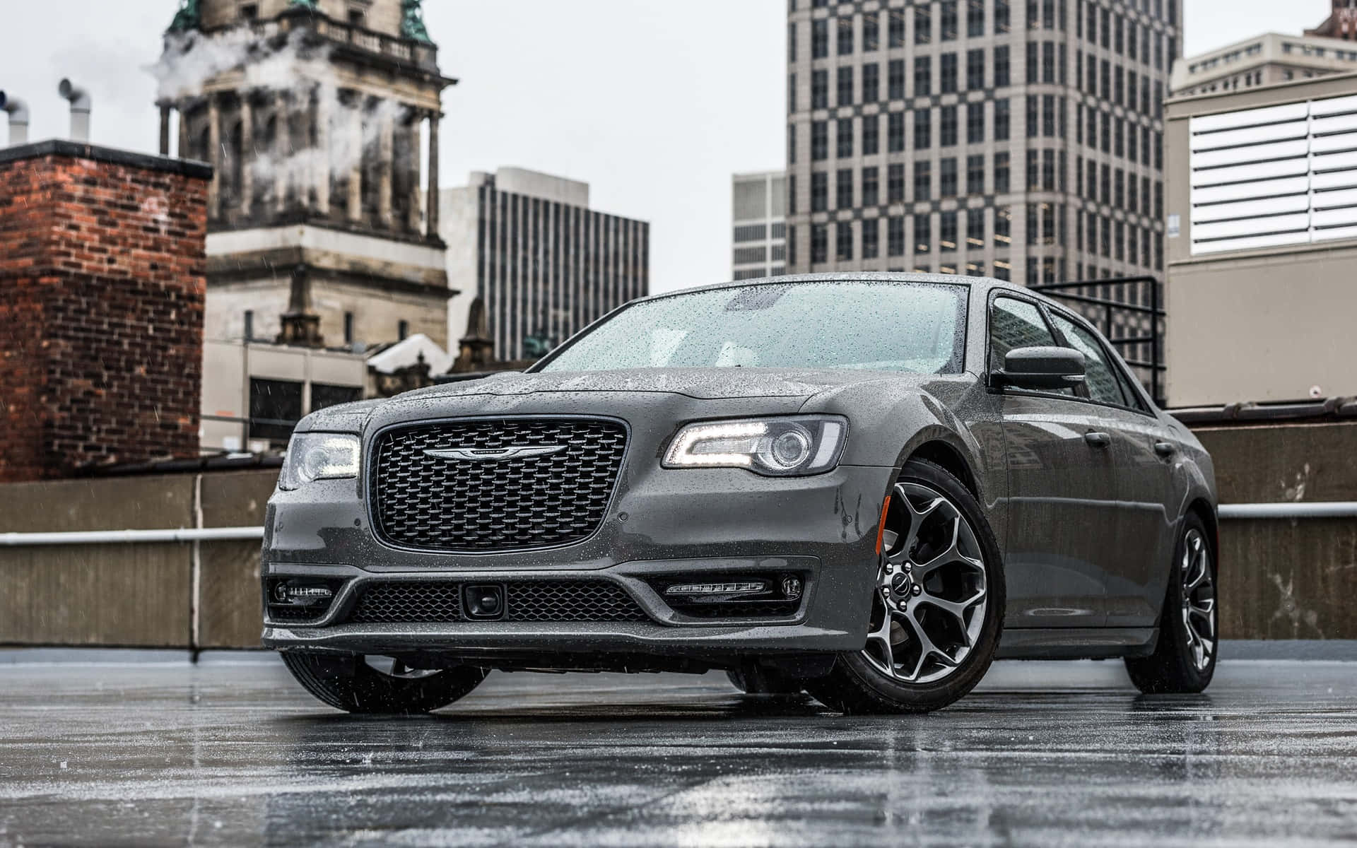 Sleek Black Chrysler 300 on the Open Road Wallpaper