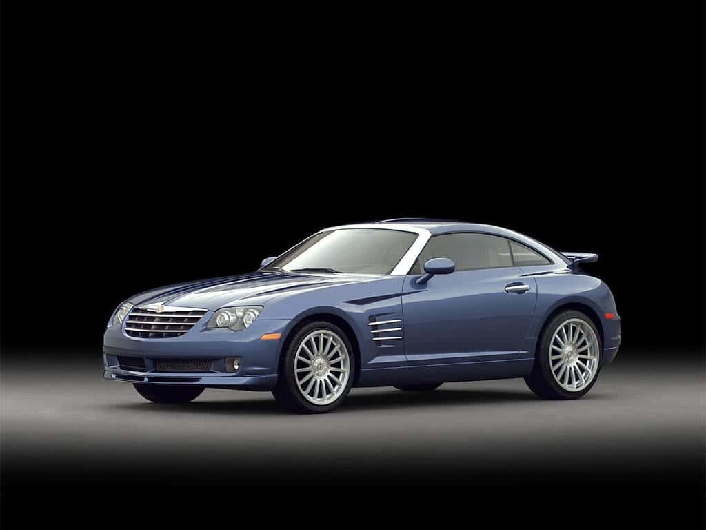 Caption: Sleek and Stylish Chrysler Crossfire on the Road Wallpaper