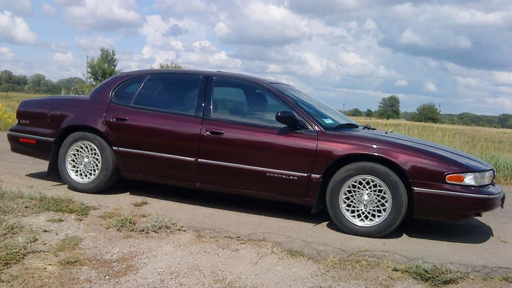 Sleek Chrysler Lhs Parked in Style Wallpaper