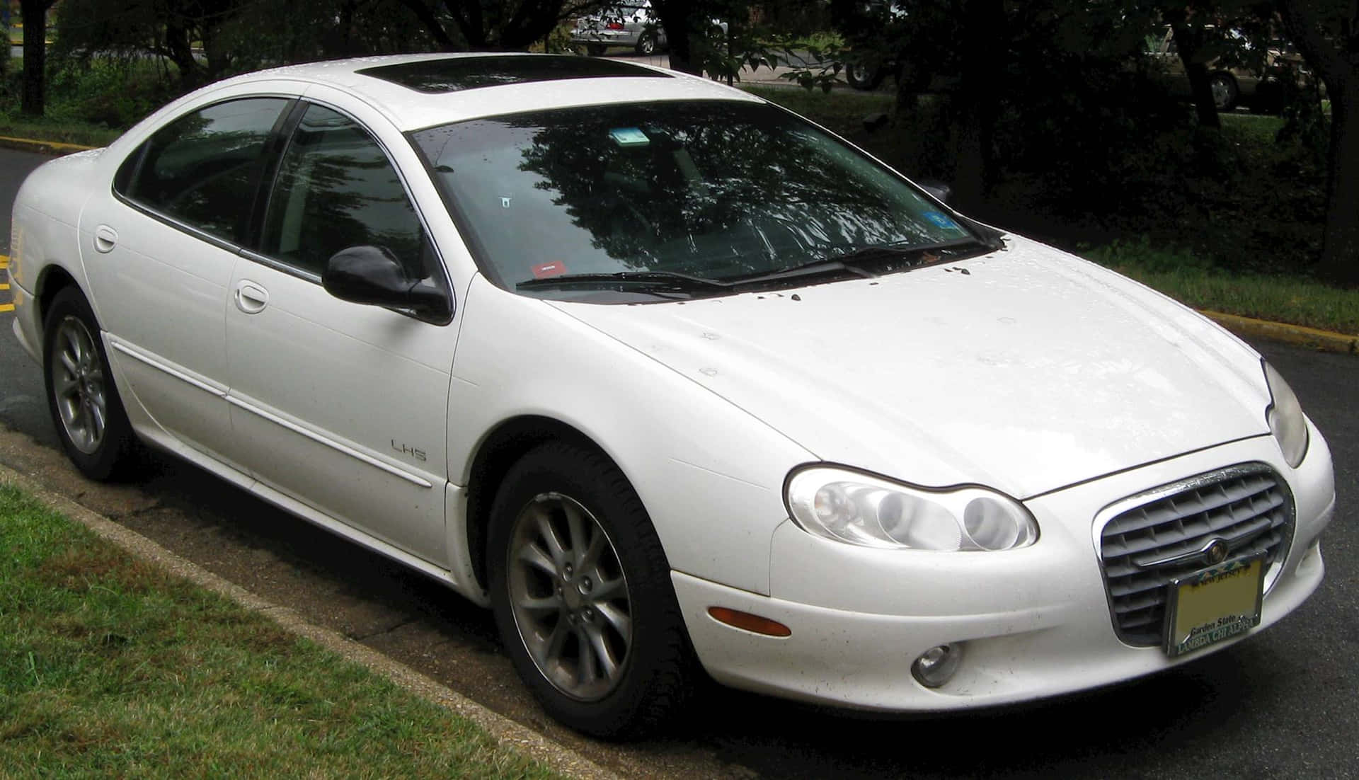 Caption: Elegant 2000 Chrysler LHS in Motion Wallpaper