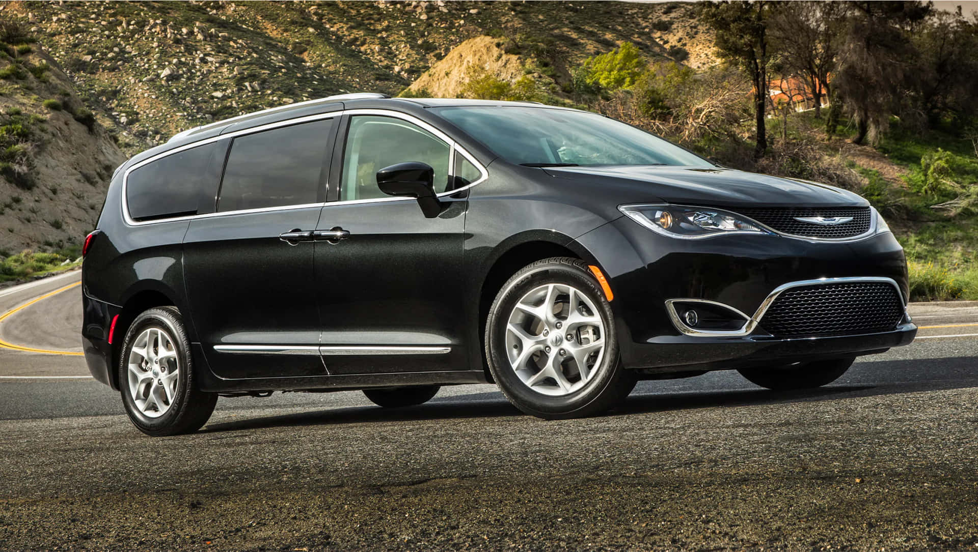 Stylish Chrysler Pacifica cruising on the open road Wallpaper