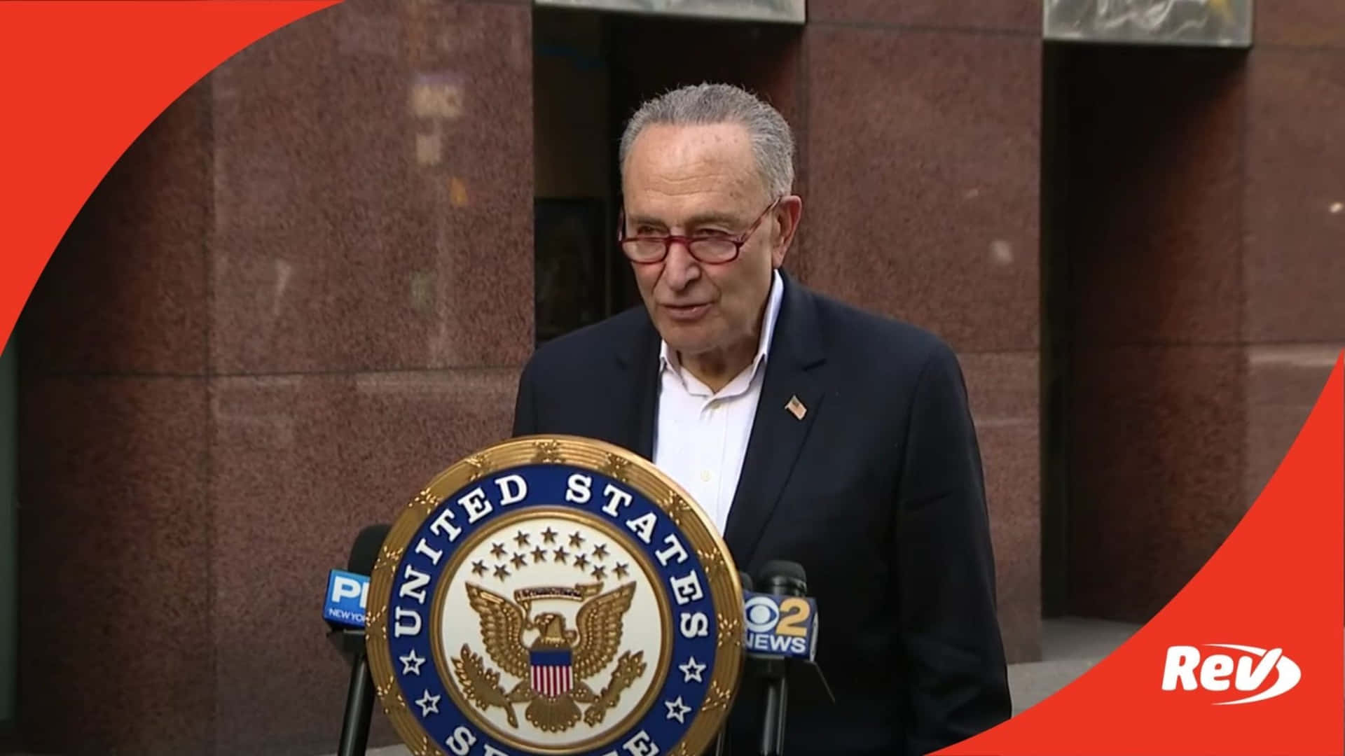 Chuck Schumer Speakingat Podium Wallpaper