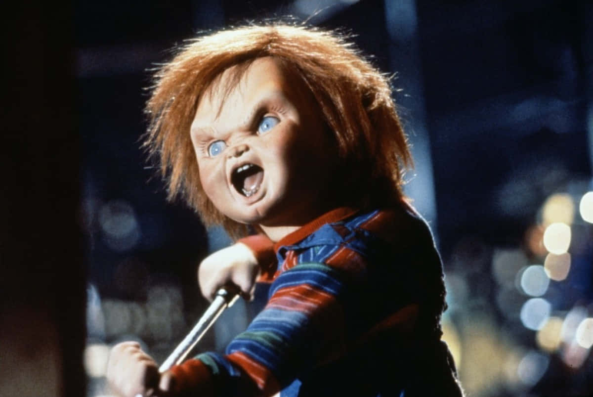 Chucky Doll Assaulting Someone Wallpaper