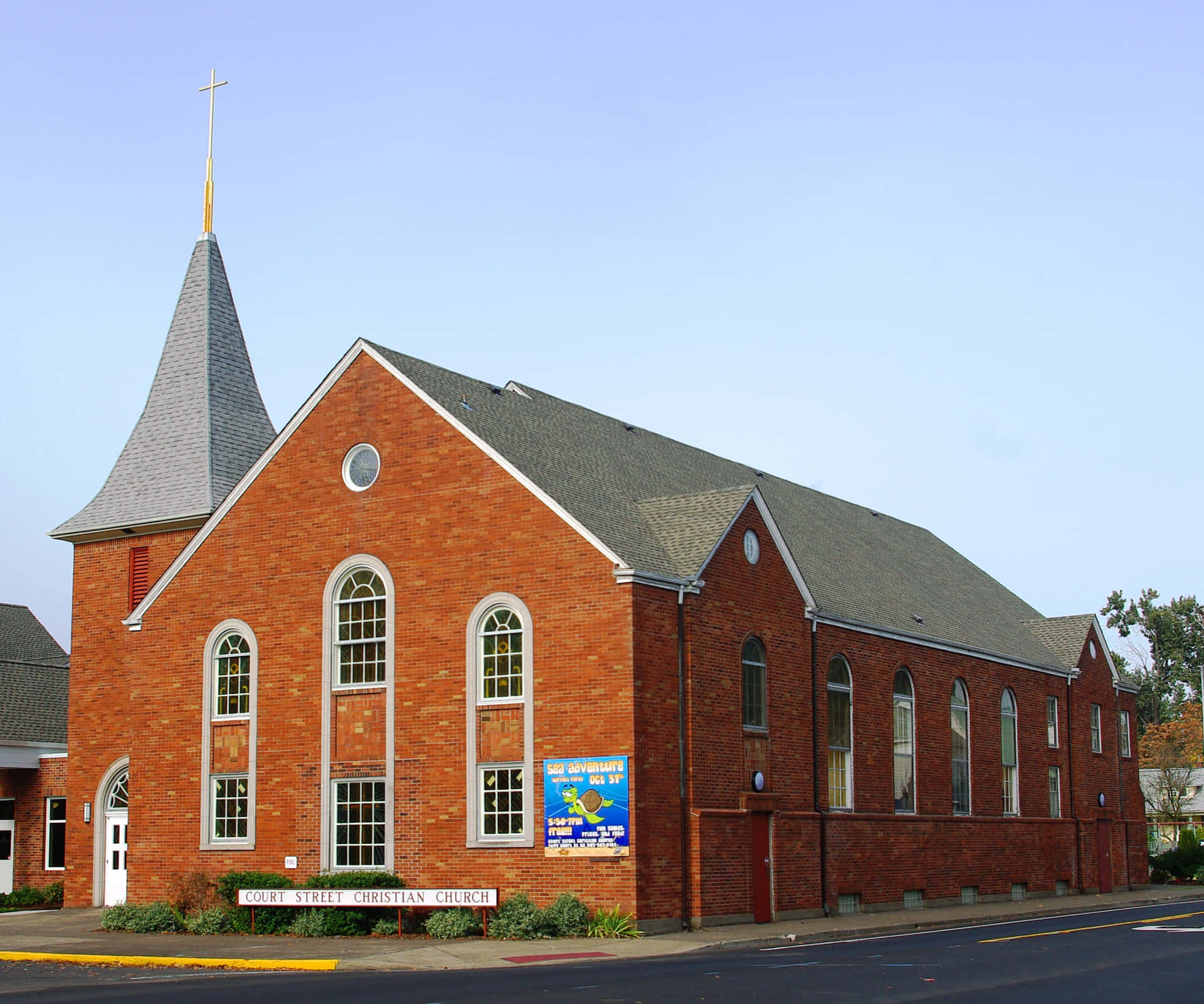 A Brick Building With A Steeple
