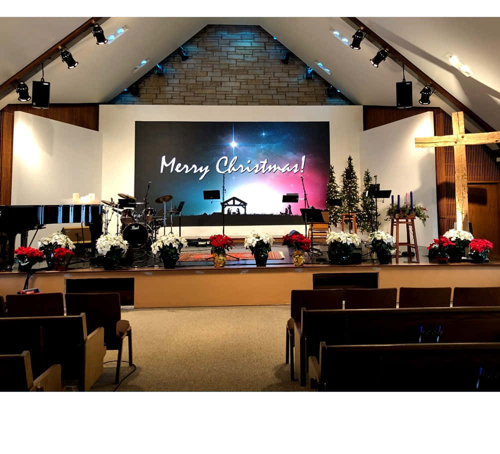 A Church With A Christmas Stage And Chairs