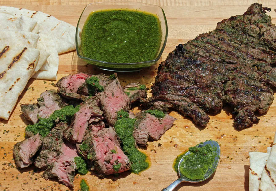 A juicy churrasco steak served with flavorful chimichurri sauce. Wallpaper