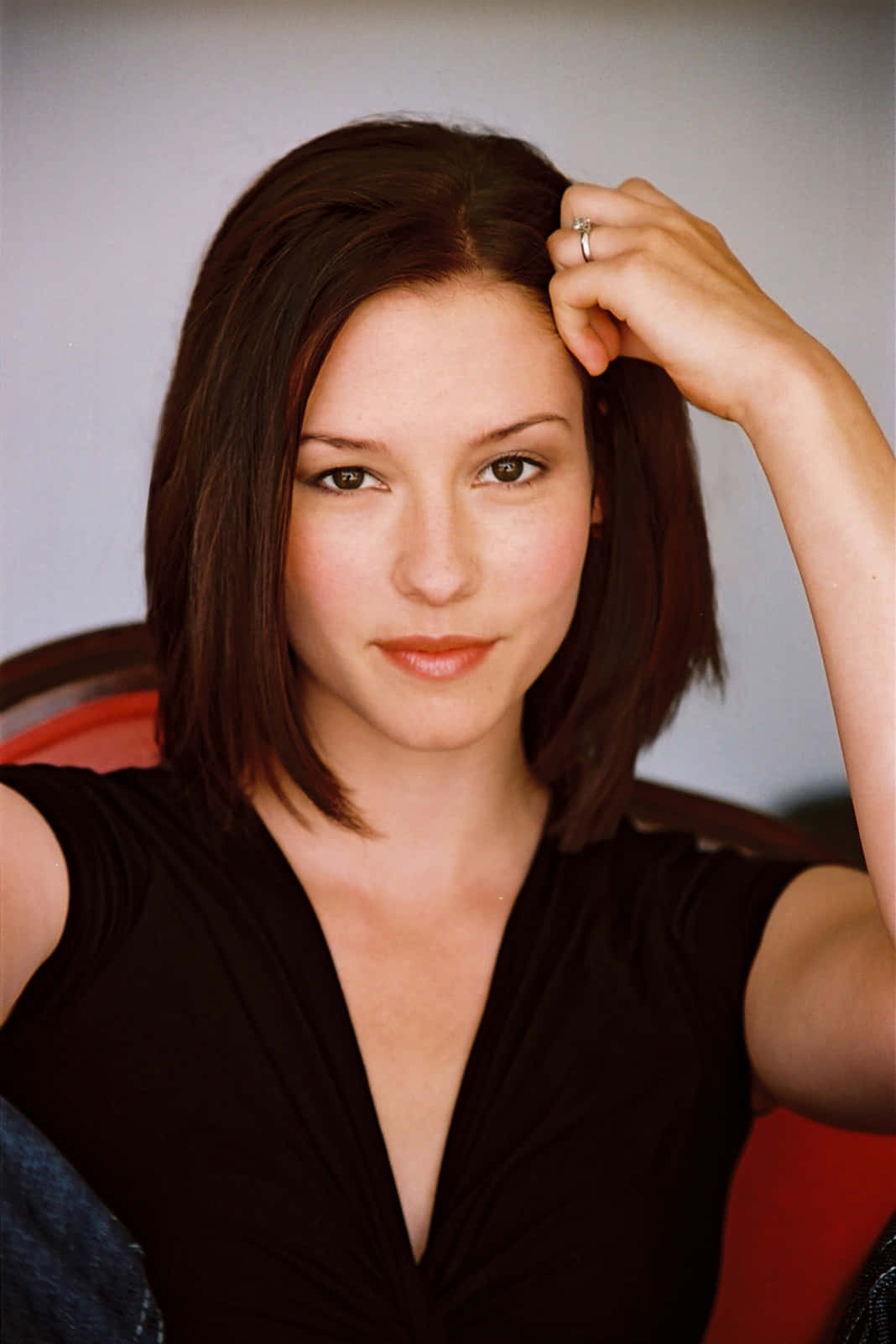 Caption: Chyler Leigh posing confidently during a photoshoot Wallpaper