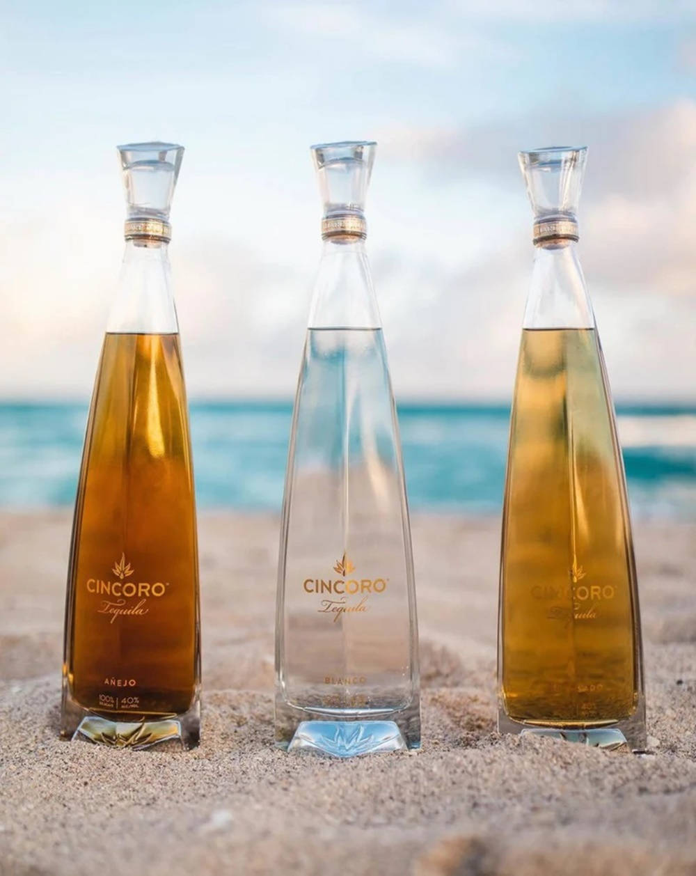 Cincoro Tequila Bottle At Beach Wallpaper