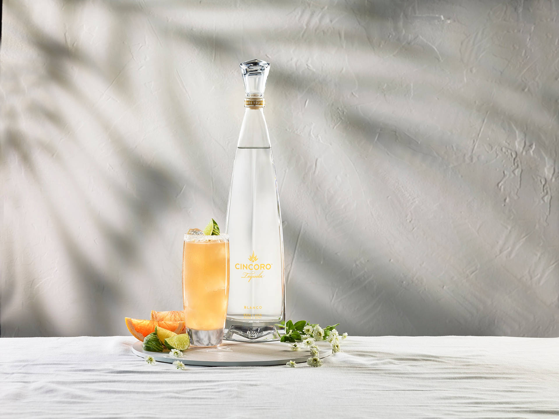 Exquisite Cincoro Tequila Bottle paired with luscious Margaritas Wallpaper
