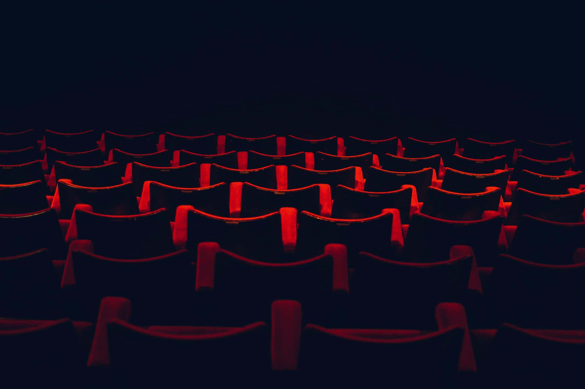 Cinema Seatsin Dark Theater Wallpaper