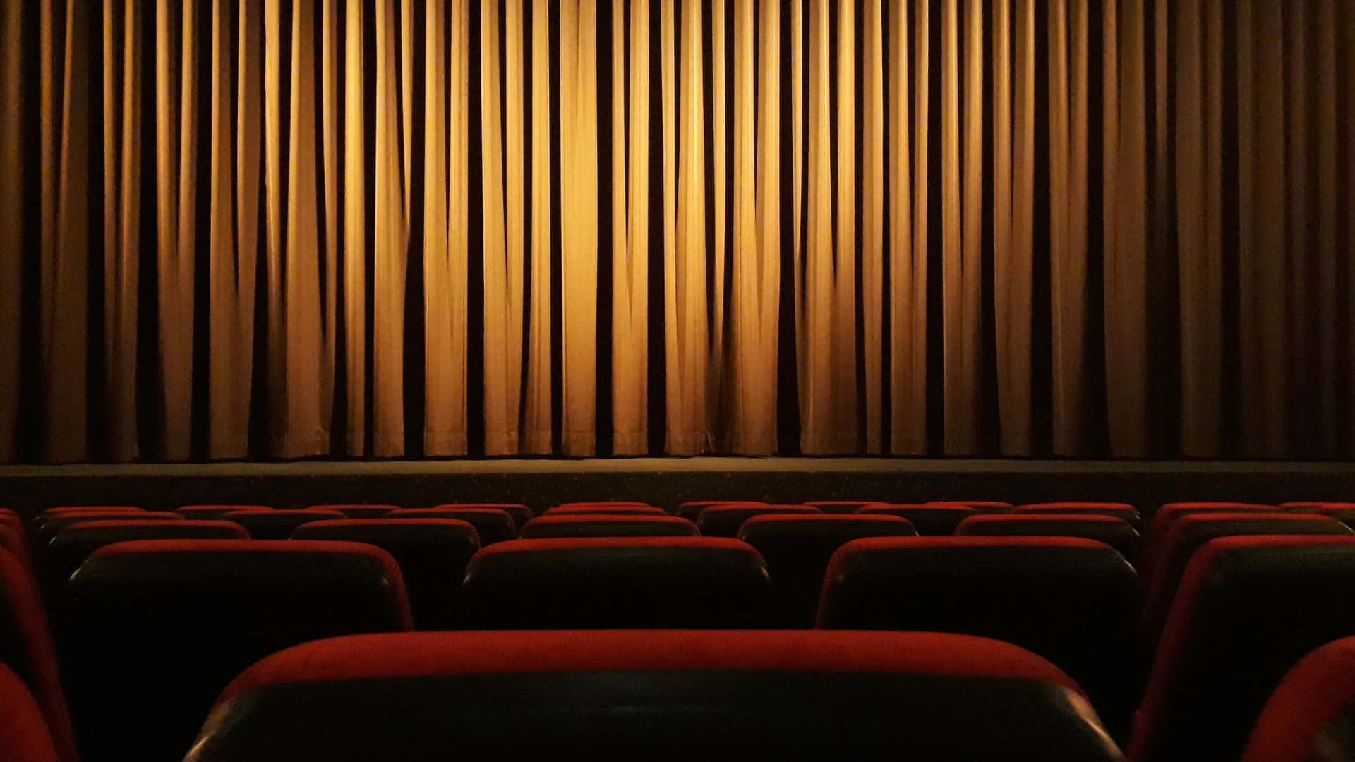 Cinema_ Theater_ Interior_with_ Curtains_and_ Seats Wallpaper