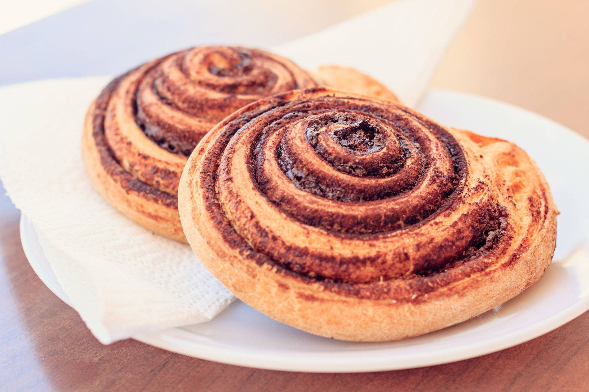Cinnamon Rolls On A Simple Pastry Plate Wallpaper