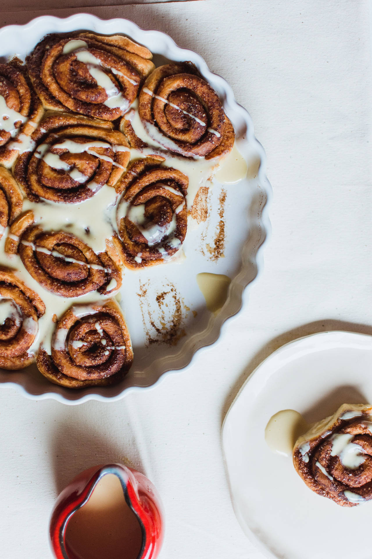 Cinnamon Rolls Topped With Milk Wallpaper